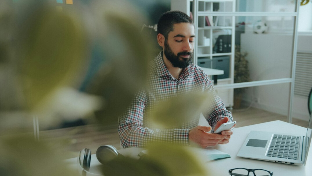 person meditating in office