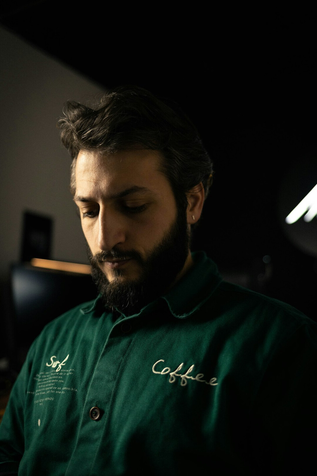 Portrait of a man physiotherapist with a light beard in a polo shirt